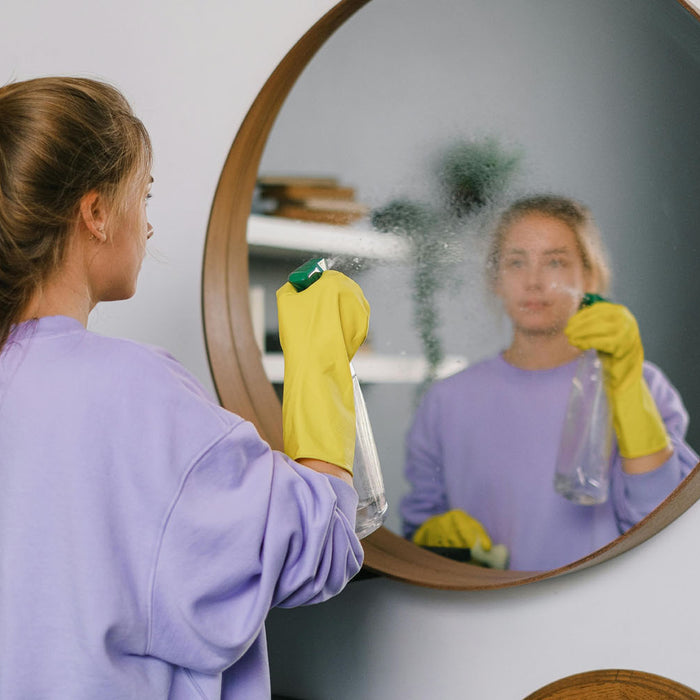 How do you clean a mirror without staining it?