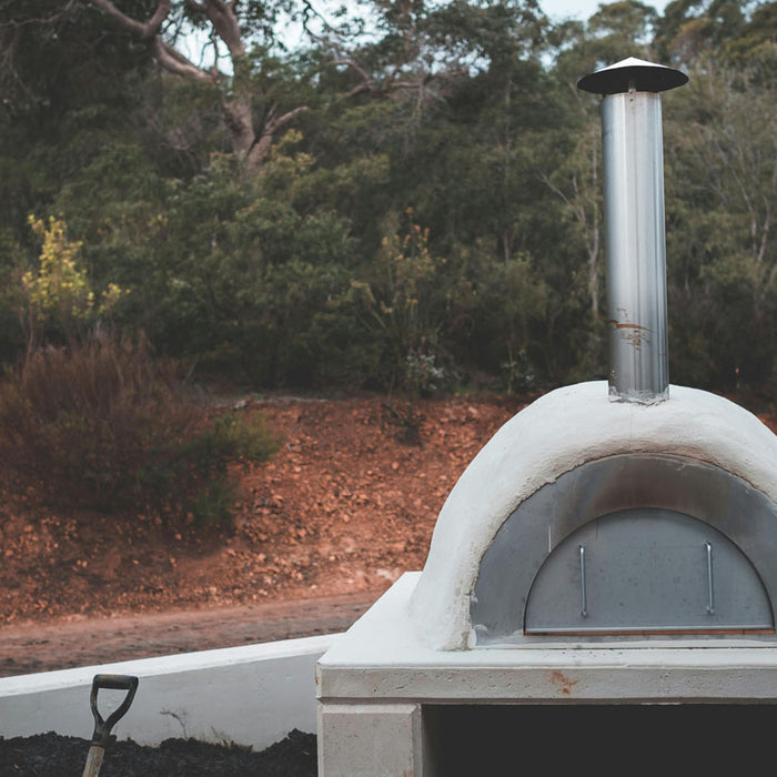 Why put glass in the bottom of a pizza oven?