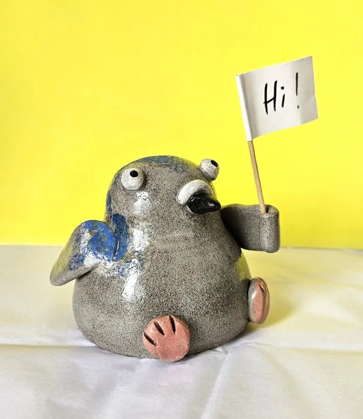 Pigeon with Sign