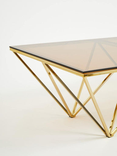 Red-Tinted Tempered Glass Top Coffee Table with Geometric Prismatic Champagne Metal Legs | Allure