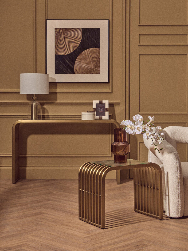 Matte Gold Slatted Console Table with Clear Glass Top | Vogue