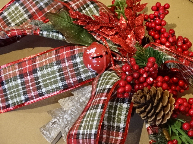 Handmade Christmas wreath with pine cones and bells