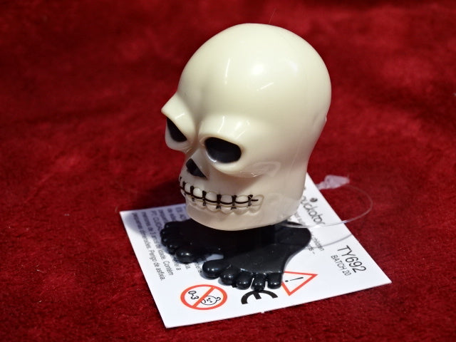 Novelty wind-up walking skull