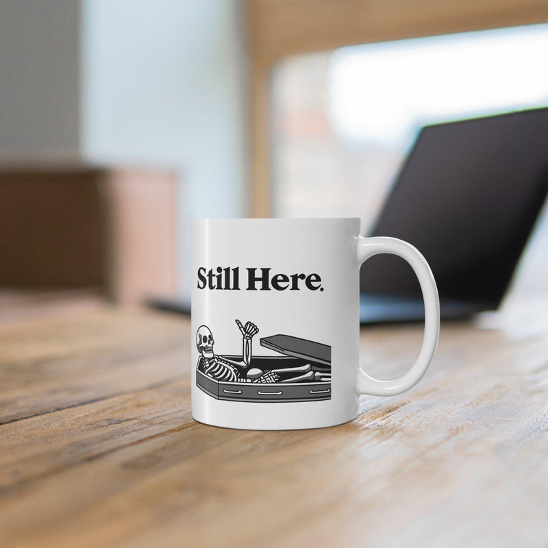Still Here Skeleton Mug – Funny Resilience Coffee Cup