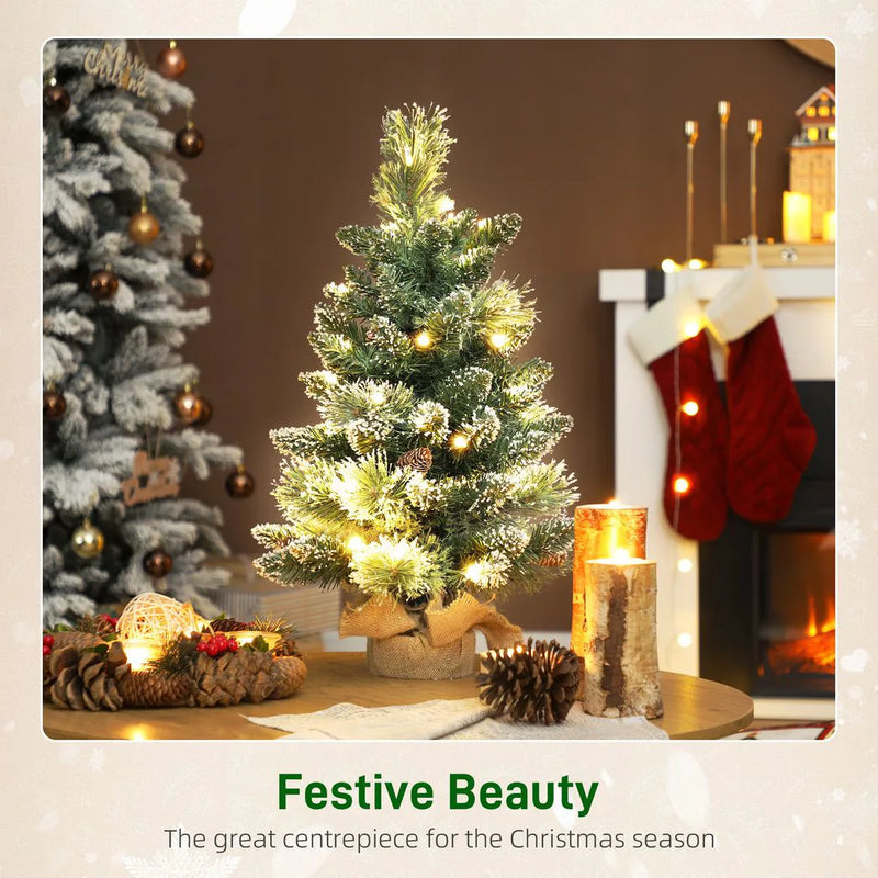 HOMCOM 60 cm Prelit Small Christmas Tree, Snow Flocked Tabletop Mini Xmas Tree with 35 LED Lights, Pine Cones and Linen Cover Base, Battery Operated, Green