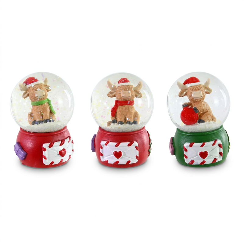 Christmas highland cow snow globe