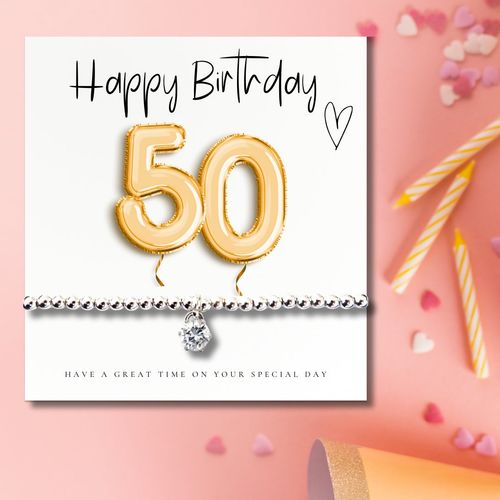 https://images.avasam.com/?url=https://avasamnew.s3.amazonaws.com/live//4322-CD_50th_Birthday_Gold_Balloons_Bracelet_Gift_Women_6a4c0cce-95d7-48ca-93bd-35548f1be419.jpg&w=500