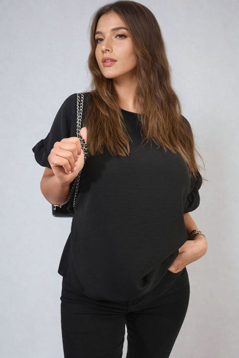 Playful Elegance: Alexandra Frill Sleeve Top - High-quality, versatile and stylish. Elevate your outfit today!