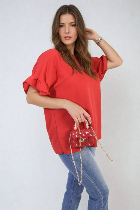 Playful Elegance: Alexandra Frill Sleeve Top - High-quality, versatile and stylish. Elevate your outfit today!