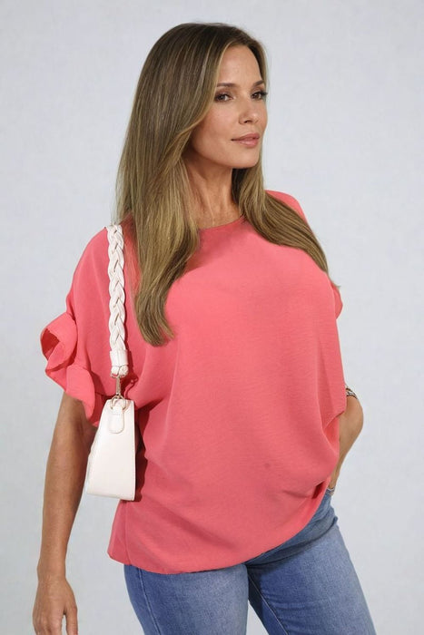 Playful Elegance: Alexandra Frill Sleeve Top - High-quality, versatile and stylish. Elevate your outfit today!