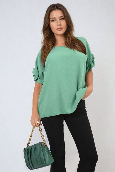 Playful Elegance: Alexandra Frill Sleeve Top - High-quality, versatile and stylish. Elevate your outfit today!