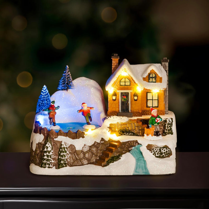 18cm Winter Village Scene with Ice Rink Christmas Decoration